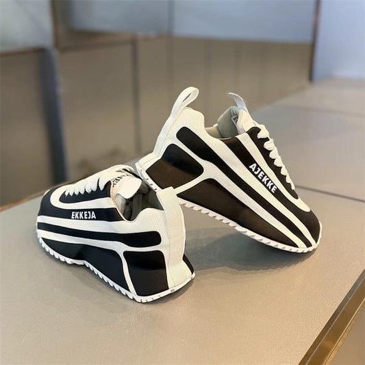 Black and white striped arch support athletic shoes