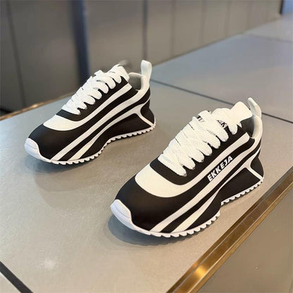 Black and white striped arch support athletic shoes